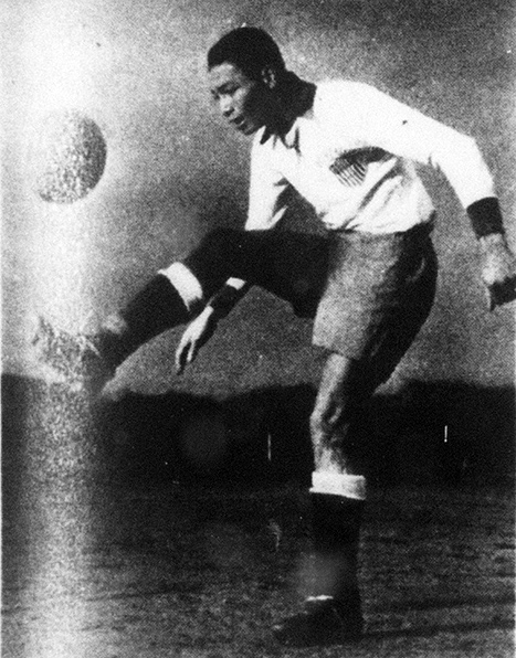Gil Heron kicking soccer ball