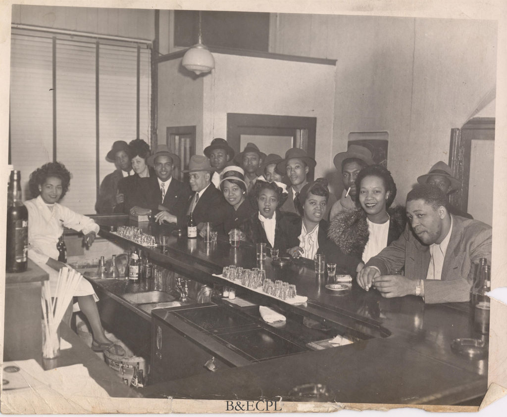 Men and women at a bar