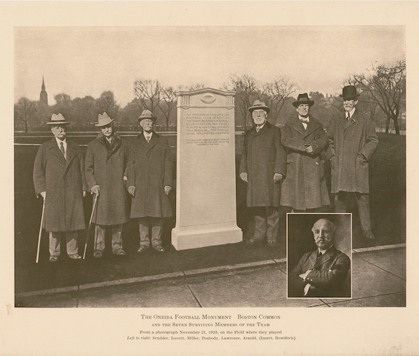 Image of the monument dedicated to the Oneidas football team with surviving members of the team on Nov. 21, 1925.